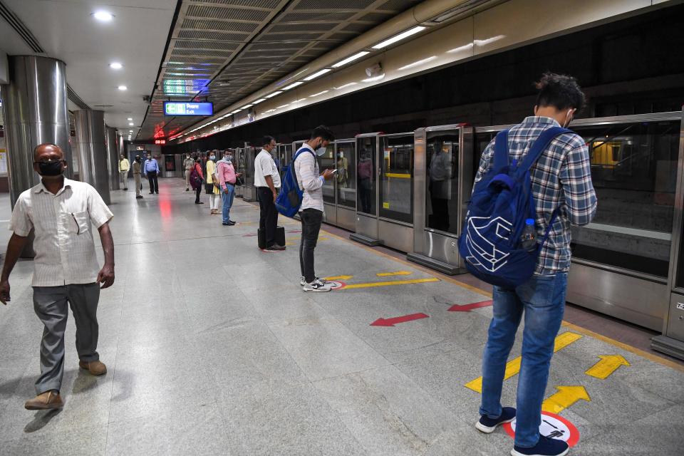 Commuters wait for a Yellow Line train in a station after Delhi Metro Rail Corporation (DMRC) resumed services in New Delhi on September 7, 2020.(Photo by PRAKASH SINGH/AFP via Getty Images)