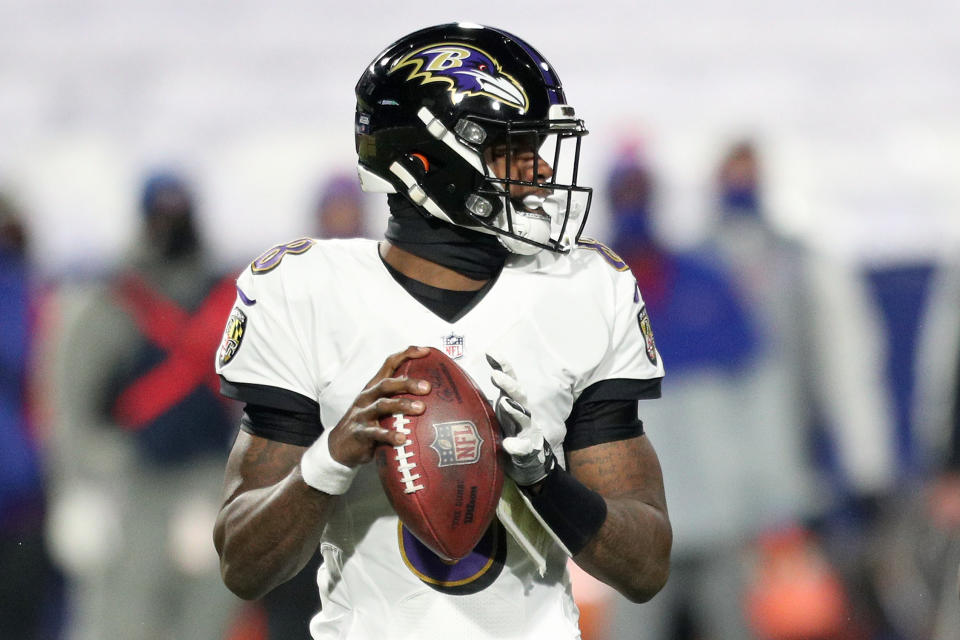 Ravens white jerseys with purple lettering and black helmets