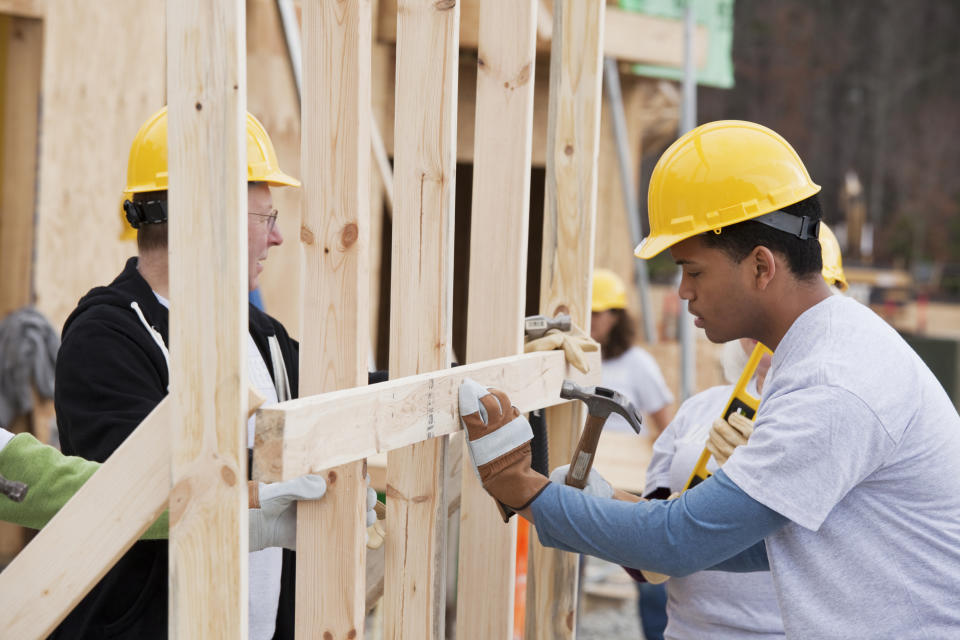 volunteers building a home