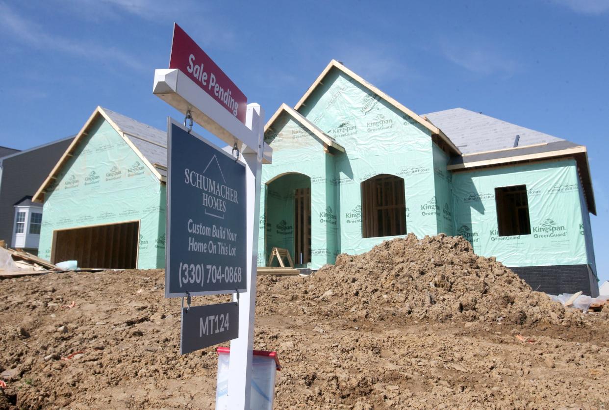 A house is shown with a sign that reads "sale pending" in Canton on Tuesday, April 12, 2022.