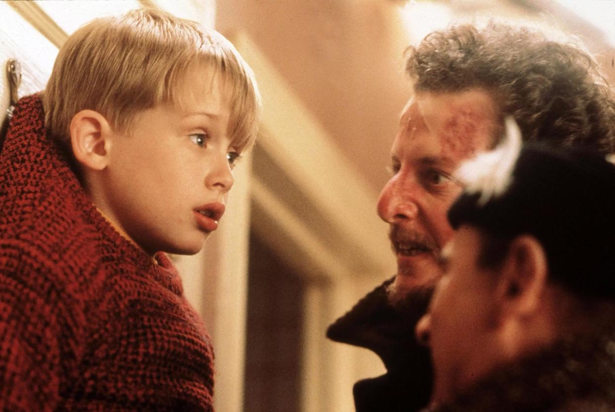 Macaulay Culkin, Daniel Stern, and Joe Pesci in 1990's Home Alone. (Alamy)