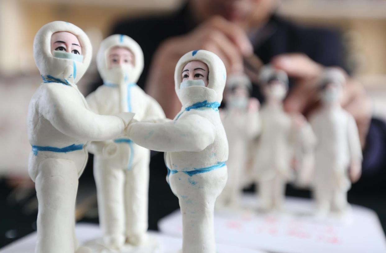 <span class="caption">Zuo Ansheng, a flour figurine master, makes flour works related to the coronavirus in Yinan county in Shandong province, Feb. 7, 2020.</span> <span class="attribution"><a class="link " href="https://www.gettyimages.com/detail/news-photo/zuo-ansheng-a-flour-figurine-master-makes-flour-works-news-photo/1199162198?adppopup=true" rel="nofollow noopener" target="_blank" data-ylk="slk:Feature China/Barcroft Media via Getty Images;elm:context_link;itc:0;sec:content-canvas">Feature China/Barcroft Media via Getty Images</a></span>