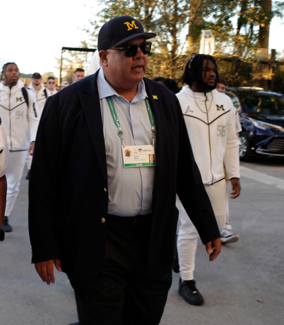 Michigan Wolverines Athletic Director Warde Manuel arrives for the Capital One Orange Bowl game against the Georgia Bulldogs Friday, Dec. 31, 2021, at Hard Rock Stadium.