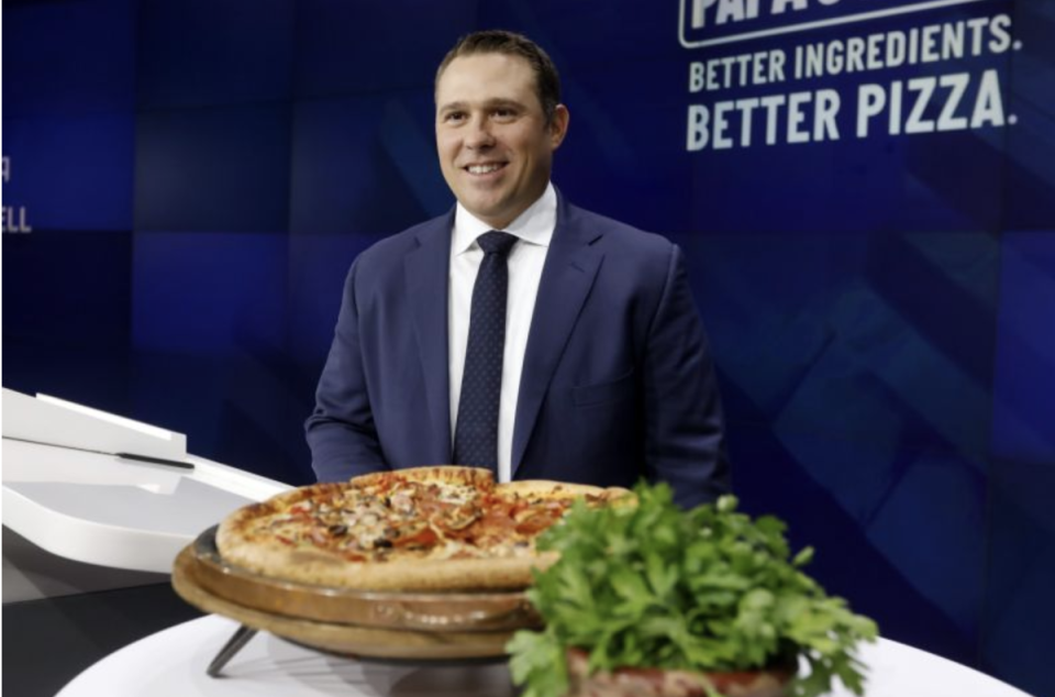 Papa John's President & CEO Rob Lynch poses for photos at the Nasdaq MarketSite in New York, before ringing bell Tuesday, Oct. 1, 2019. (AP Photo/Richard Drew)