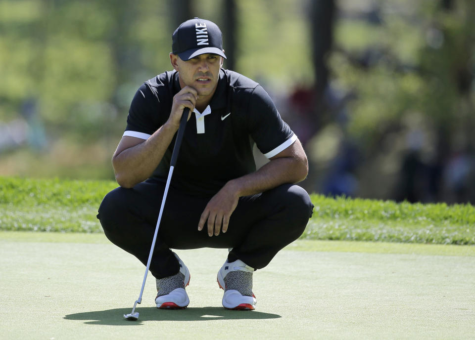 Brooks Keopka lines up a putt on the second green during the third round of the PGA Championship golf tournament, Saturday, May 18, 2019, at Bethpage Black in Farmingdale, N.Y. (AP Photo/Seth Wenig)