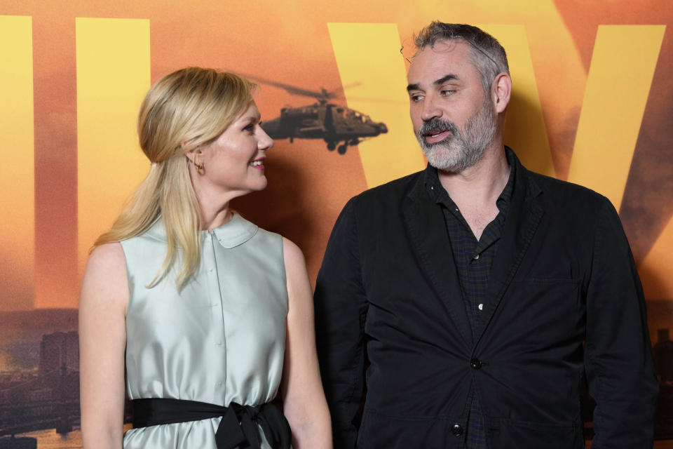 Kirsten Dunst, left, and Alex Garland pose for photographers on arrival at the special screening of the film 'Civil War' in London, on Tuesday, March 26, 2024. (Scott A Garfitt/Invision/AP)