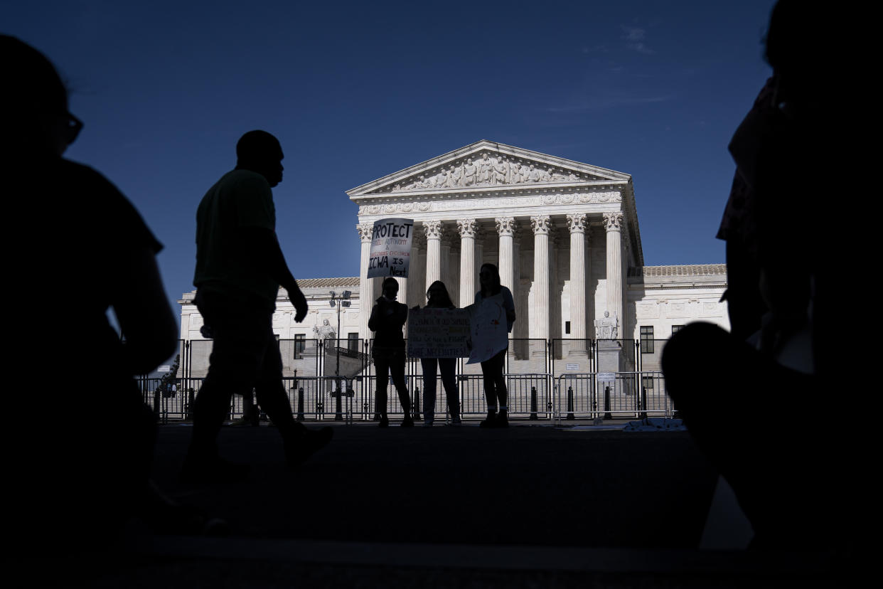 A small group of abortion-rights supporters gather in front of the Supreme Court on June 28, 2022 in Washington, DC. (Photo by Nathan Howard/Getty Images)