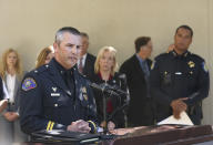 Commander Aaron Johnson, of the Rohnert Park Police Department, left, discusses the arrest of Roy Charles Waller, who is suspected of committing a series of rapes, during a news conference Friday, Sept. 21, 2018, in Sacramento, Calif. Waller, 58, was arrested on Thursday, Sept. 20, by Sacramento Police, and is suspected of committing at least 10 rapes across Northern California between 1991 and 2006. In the background is Sacramento County District Attorney Anne Marie Schubert, center, Sacramento Police Chief Daniel Hahn, right. (AP Photo/Rich Pedroncelli)