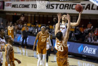 Oklahoma State guard Cade Cunningham (2) shoots a layup over Texas forward Brock Cunningham (30) during the first overtime of the NCAA college basketball game in Stillwater, Okla., Saturday, Feb. 6, 2021. (AP Photo/Mitch Alcala)