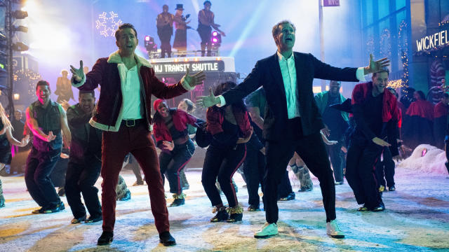 Ryan Reynolds and Will Ferrell take on all-singing-all-dancing leading roles in Spirited. (Apple TV+)