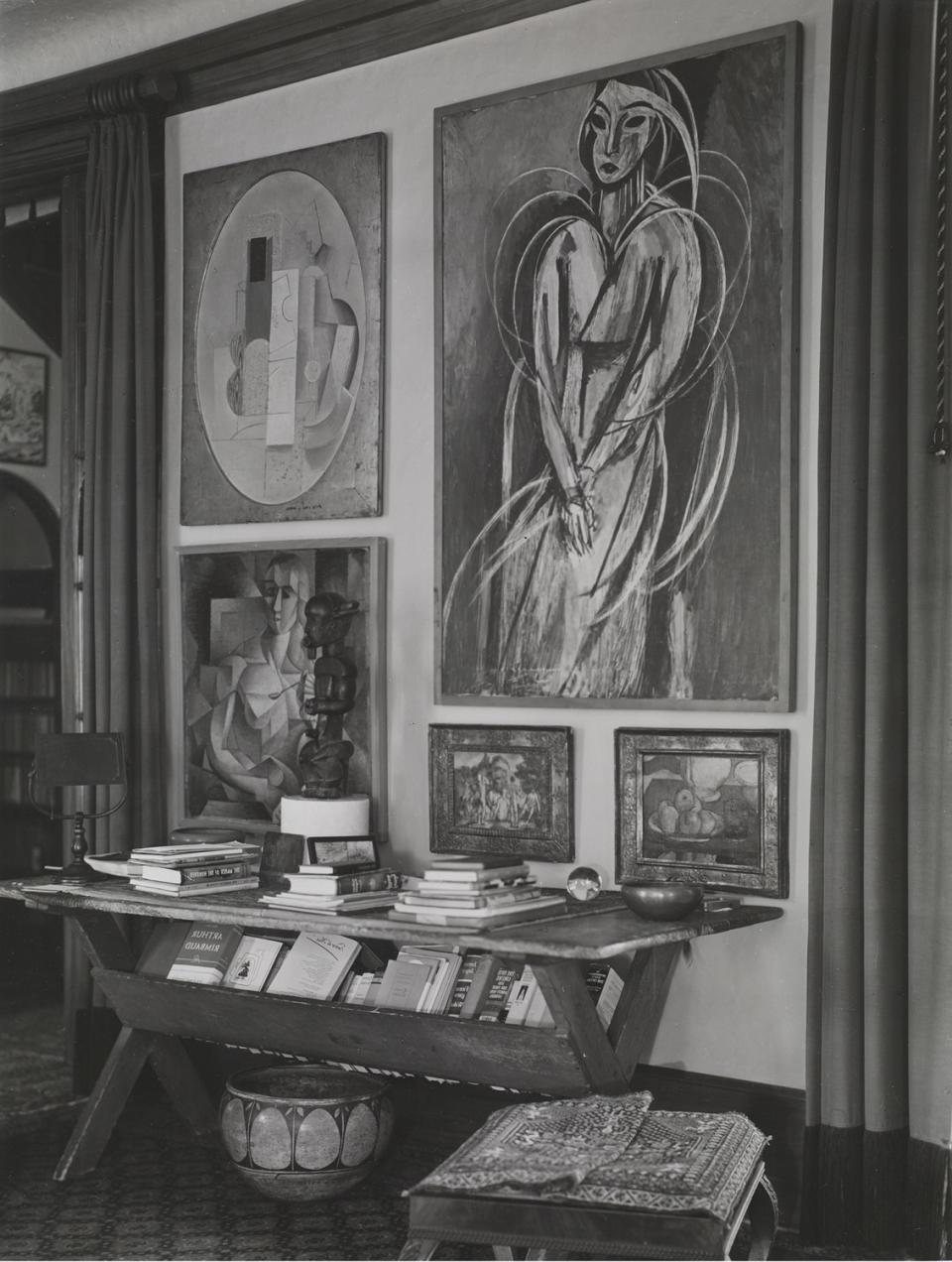 A 1912 Picasso Cubist still life hangs next to a 1913-14 Matisse portrait in the Arensbergs' living room.