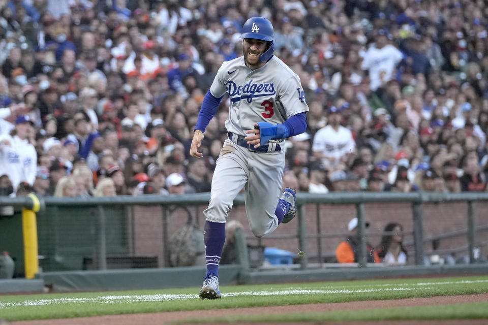 Los Angeles Dodgers' Chris Taylor (3) rounds third base to score a run on a single by Justin Turner against the San Francisco Giants during the third inning of a baseball game Wednesday, July 28, 2021, in San Francisco. (AP Photo/Tony Avelar)