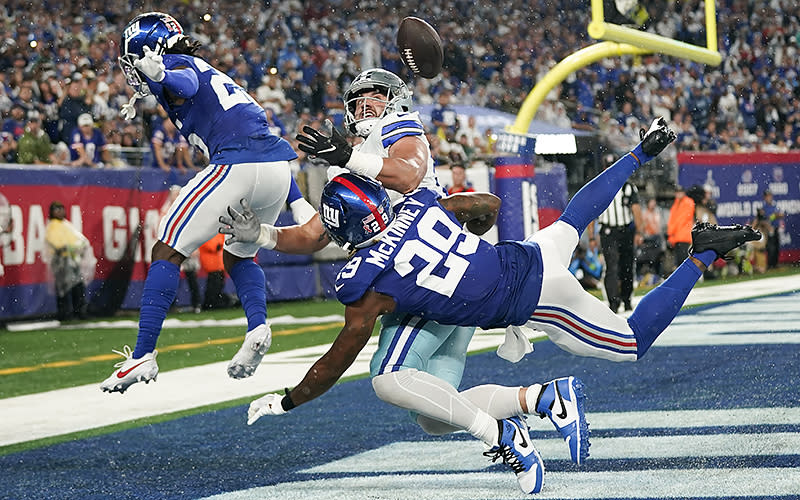 New York Giants defensive backs Deonte Banks, left, and Xavier McKinney break up a pass intended for Dallas Cowboys tight end Jake Ferguson during their Sept. 10 game in East Rutherford, N.J. <em>Associated Press/Bryan Woolston</em>