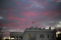 FILE - In this Jan. 27, 2017, file photo, day breaks over the White House in Washington. Two weeks into his presidency, Donald Trump has thrown Washington into a state of anxious uncertainty. Policy pronouncements sprout up from the White House in rapid succession. Some have far-reaching implications, most notably Trump’s temporary refugee and immigration ban, but others disappear without explanation, including planned executive actions on cybersecurity and the president’s demand for an investigation into unsubstantiated voter fraud. The day’s agenda can quickly be overtaken by presidential tweets, which often start flashing on smartphones just as the nation’s capital is waking up. (AP Photo/Pablo Martinez Monsivais, File)