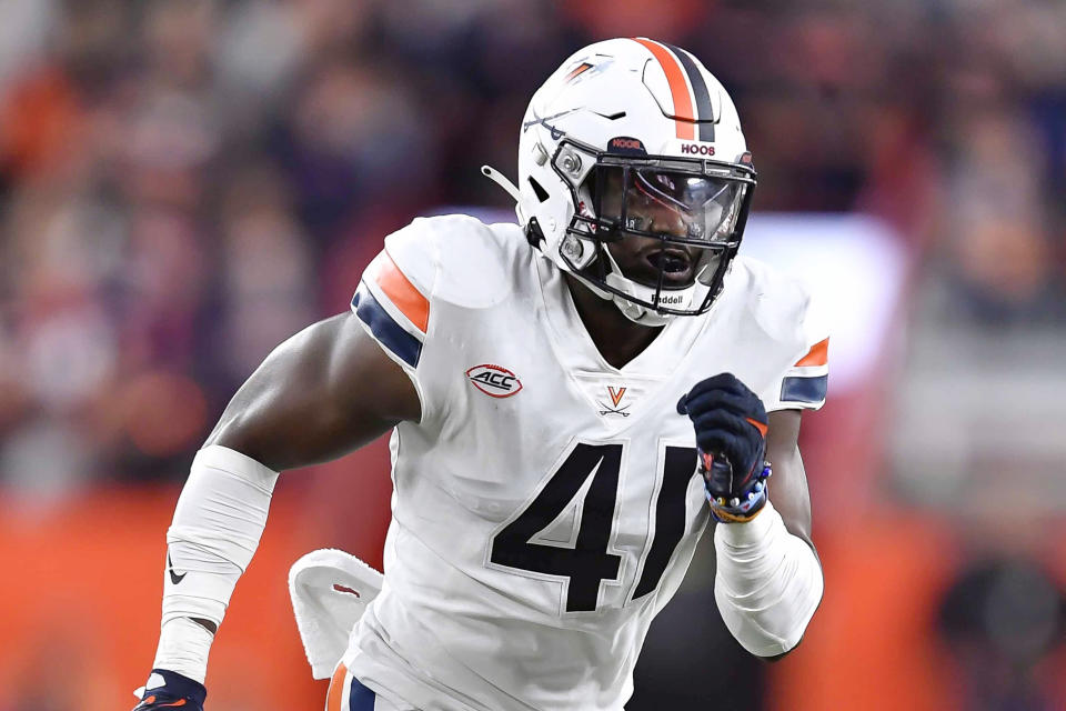 FILE - Virginia linebacker D'Sean Perry runs on the field during the second half of an NCAA college football game against Syracuse on Sept. 23, 2022 in Syracuse, N.Y. Perry was one of three Virginia football players killed in a shooting, Sunday, Nov. 13, 2022, in Charlottesville, Va., while returning from a class trip to see a play. (AP Photo/Adrian Kraus, File)