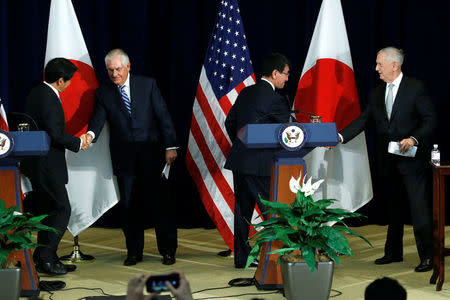 Japan's Defense Minister Itsunori Onodera (L-R), U.S. Secretary of State Rex Tillerson, Japan's Foreign Minister Taro Kono and U.S. Defense Secretary James Mattis shake hands at the end of a news conference after their U.S.-Japan Security talks at the State Department in Washington, U.S., August 17, 2017. REUTERS/Jonathan Ernst