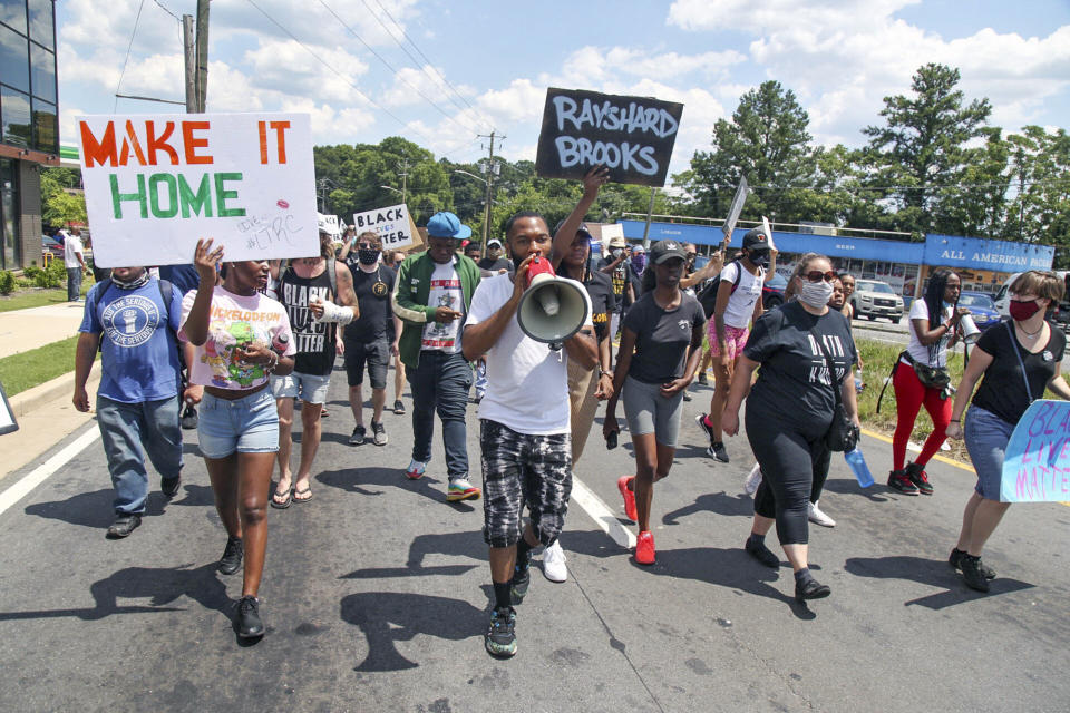 Protestors gather on University Ave near a Wendy's restaurant, Saturday, June 13, 2020 in Atlanta. Georgia authorities said Saturday a man was shot and killed in a late night struggle with Atlanta police outside a fast food restaurant after he failed a field sobriety test and resisted arrest. (Steve Schaefer/Atlanta Journal-Constitution via AP)