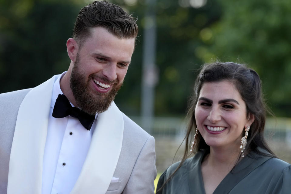 Kansas City Chiefs kicker Harrison Butker and his wife Isabelle arrive on the red carpet before a ceremony for team members to receive their championship rings for winning NFL's Super Bowl 58 football game Thursday, June 13, 2024, in Kansas City, Mo. (AP Photo/Charlie Riedel)