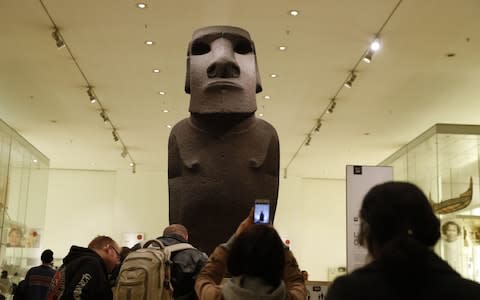 An ancestor figure 'moai' known as Hoa Hakananai'a stands at the entrance to the Wellcome gallery in the British Museum - Credit: AFP