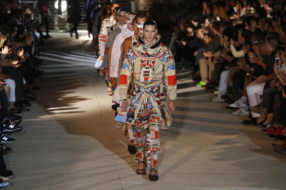 Models present creations as part of the Givenchy men's fashion Spring-Summer 2014 collection, presented Friday, June 28, 2013 in Paris. (AP Photo/Francois Mori)