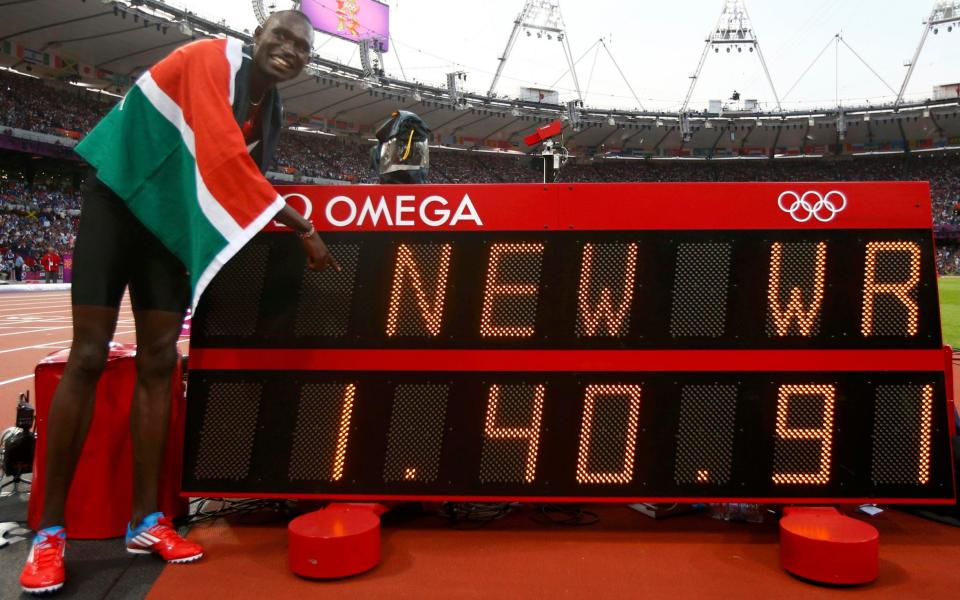 Kenya's David Lekuta Rudisha points to the new world record he set after winning the men's 800m final at the London 2012 Olympic Games at the Olympic Stadium