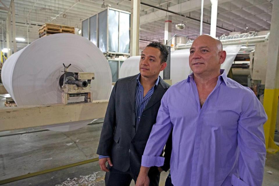 Juan Corzo Jr. and his father Juan at South Florida Tissue Paper Company in Miami Gardens. The Corzo family’s company has been working around the clock to produce toilet paper since the coronavirus pandemic caused panic buying of sanitary tissue.