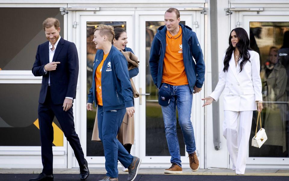 Prince Harry, Duke of Sussex and his wife, Meghan, Duchess of Sussex arrive on the Yellow Carpet before the start of the Invictus Games in The Hague - SEM VAN DER WAL/EPA-EFE/Shutterstock 