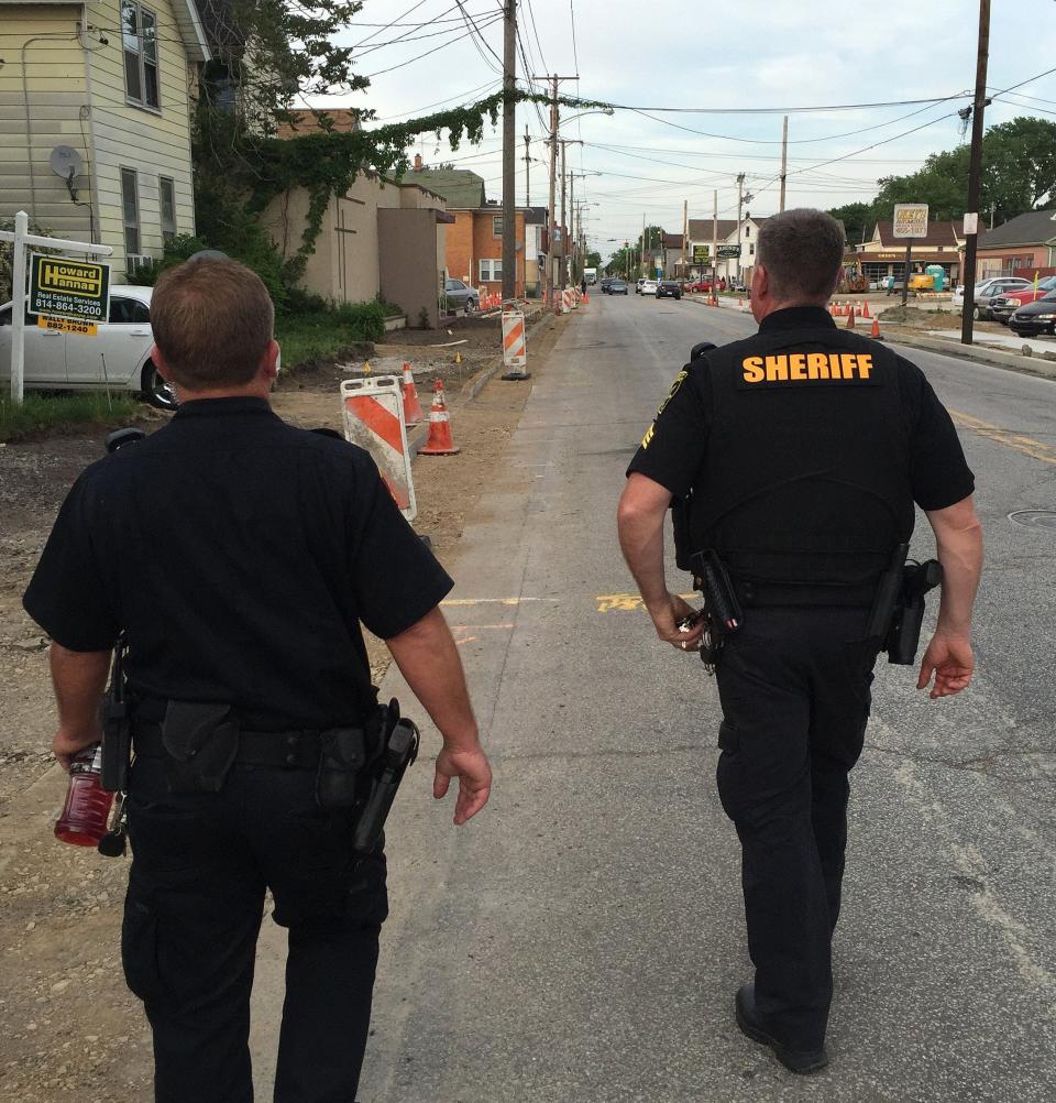 Erie police and Erie County sheriff's deputies patrol Erie's Little Italy neighborhood in May 2016 under a federal grant program designed to curb crime and build police-community relationships in the neighborhood. A similar program is launching in a portion of Erie's east side.