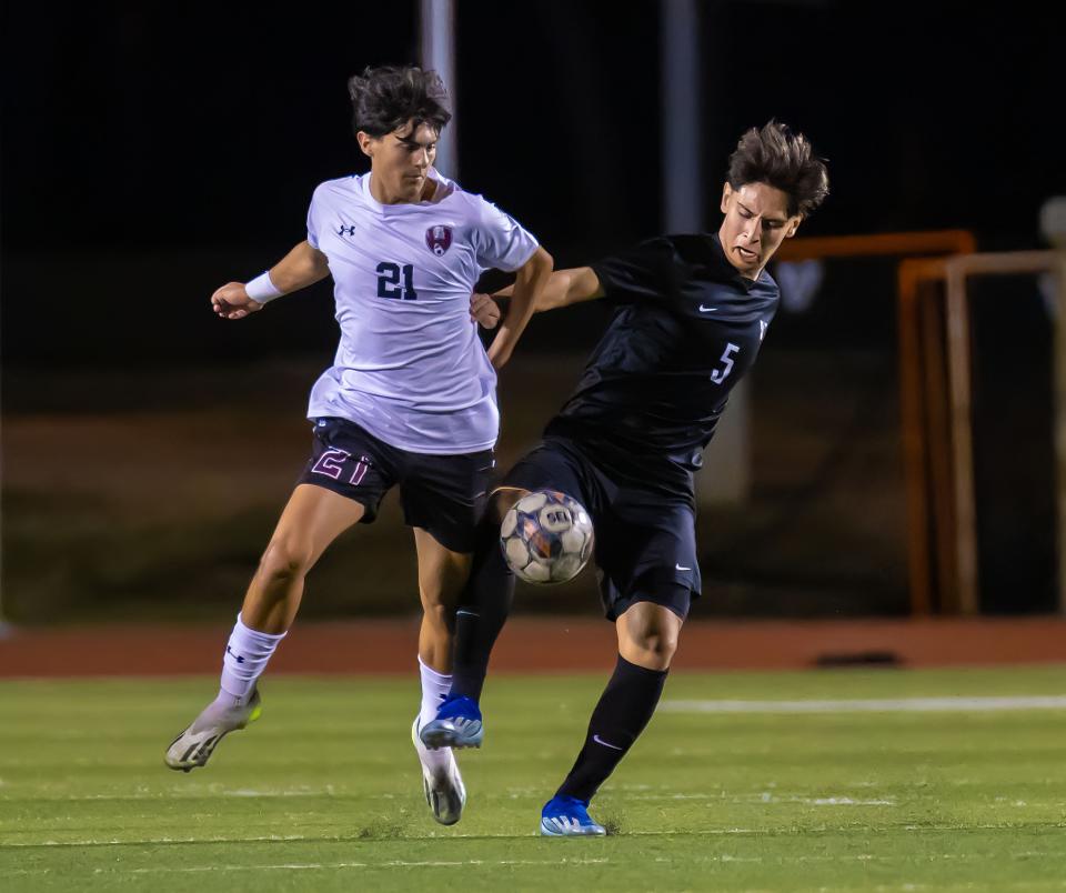 Vandegrift's Emmy Aranda knees the ball away from Round Rock's Isaiah Chandler during an early-season match. Vandegrift fell to Flower Mound 2-0 in Friday night's Class 6A state soccer semifinals.