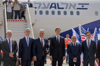 U.S. Presidential Adviser Jared Kushner, center right, and U.S. National Security Adviser Robert O'Brien, center left, pose with members of the Israeli-American delegation in front of the El Al's flight, which will carry the delegation from Tel Aviv to Abu Dhabi, at the Ben-Gurion Airport near Tel Aviv, Israel Monday, Aug. 31, 2020. (Menahem Kahana/Pool Phovo via AP)