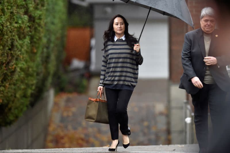 FILE PHOTO: Huawei Technologies Chief Financial Officer Meng leaves her home to attend a court hearing in Vancouver