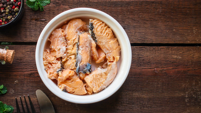 Canned salmon in white bowl