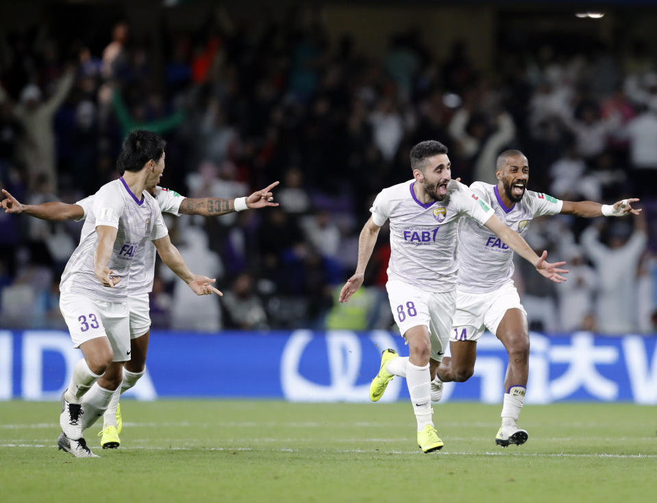 Emirates's Al Ain players celebrate after a penalty shootout at the end of the Club World Cup semifinal soccer match between Al Ain Club and River Plate at the Hazza Bin Zayed stadium in Al Ain, United Arab Emirates, Tuesday, Dec. 18, 2018. (AP Photo/Hassan Ammar)