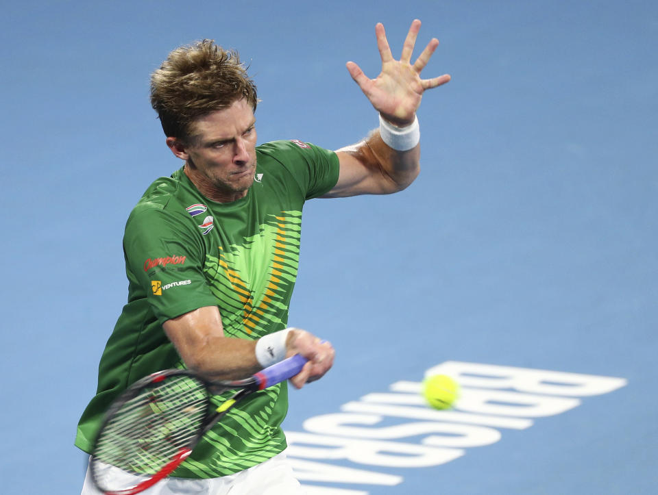 Kevin Anderson of South Africa plays a shot during his match against Novak Djokovic of Serbia at the ATP Cup tennis tournament in Brisbane, Australia, Saturday, Jan. 4, 2020. (AP Photo/Tertius Pickard)