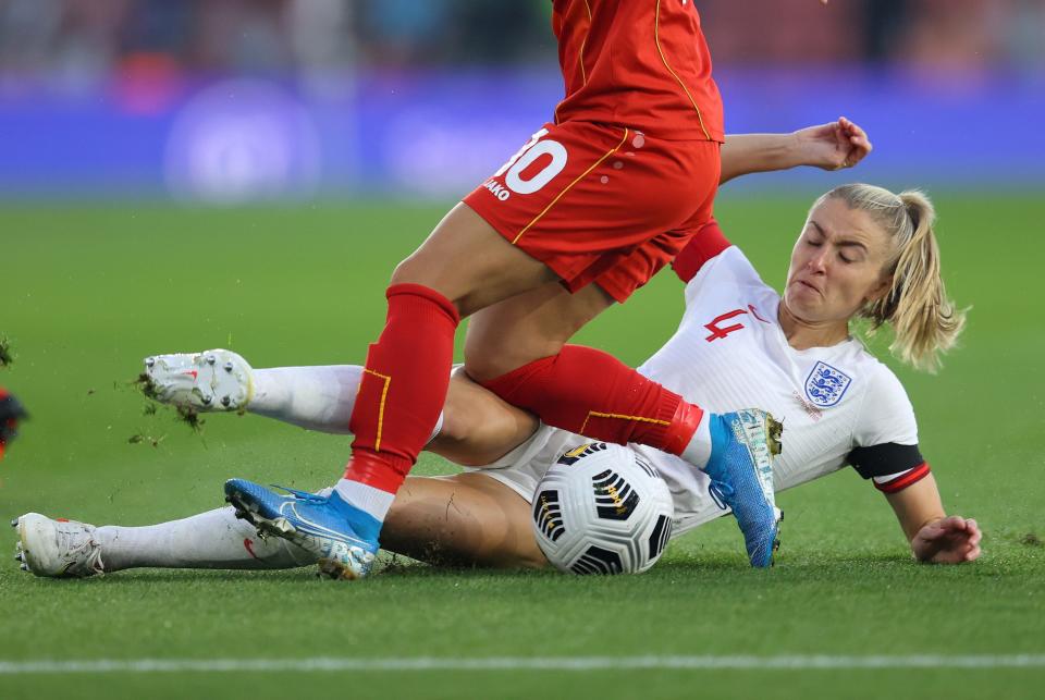 England's Leah Williamson makes a tackle during a World Cup qualifying match.