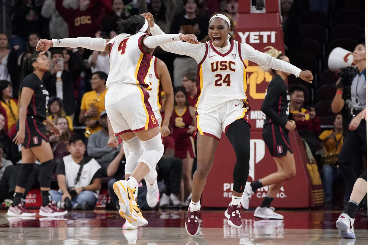 USC's Kayla Williams, left, and Okako Adika celebrates after USC upset Stanford 55-46 in a Pac-12 women's college basketball game on Jan. 15, 2023, in Los Angeles. (AP Photo/Mark J. Terrill)