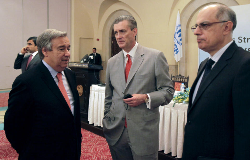 FILE - United Nations High Commissioner for Refugees (UNHCR) Antonio Guterres, left, talks with the U.S. Ambassador to Pakistan Richard Olson, center, and a diplomat during the launch ceremony of the Solutions Strategy for Afghan Refugees in Islamabad, Pakistan, Wednesday, April 30, 2014. Olson was sentenced to three years of probation and ordered to pay a $93,350 fine Friday, Sept. 15, 2023, for improperly helping a wealthy Persian Gulf country influence U.S. policy and not disclosing gifts he received from a disgraced political fundraiser. (AP Photo/Anjum Naveed, File)