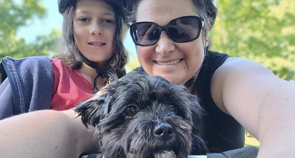  Kathryn Stanislawski and her son Lachlan with their dog Lexy on a bike ride enjoying time together on a non-migraine day off from work..