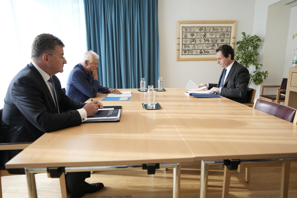 Kosovo's Prime Minister Albin Kurti, right, waits for the start of a meeting with European Union foreign policy chief Josep Borrell, second left, and EU Special Representative Miroslav Lajcak, left, in Brussels, Thursday, Sept. 14, 2023. The leaders of Serbia and Kosovo are holding a fresh round of meetings on Thursday aimed at improving their strained relations as calls mount for a change in the Western diplomatic approach toward them amid concern that their tensions could spiral out of control. (AP Photo/Virginia Mayo)