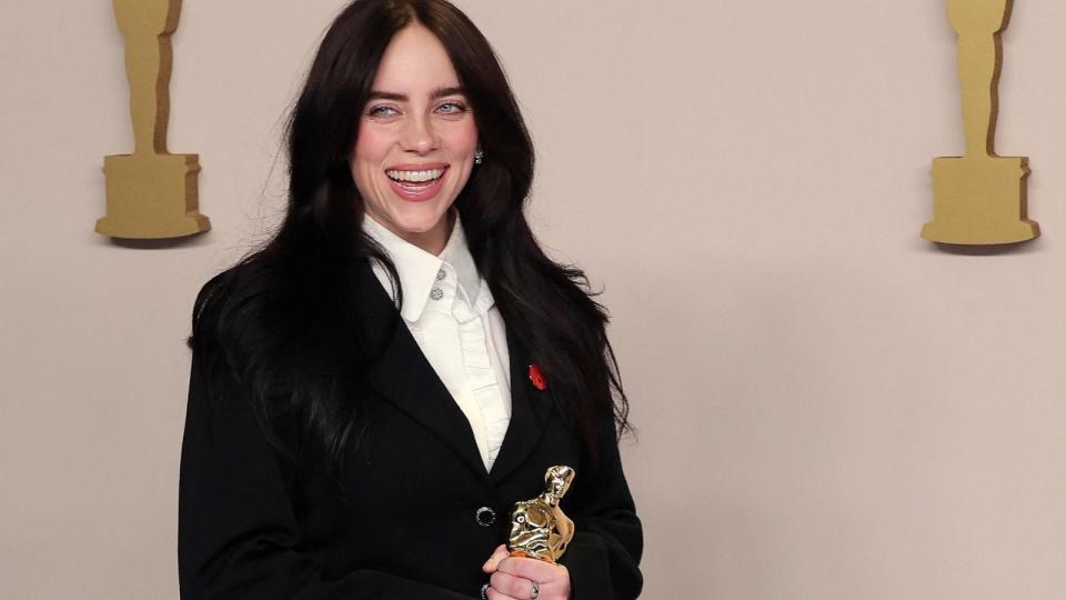 PHOTO: Billie Eilish poses with the Oscar for Best Original Song for 'What Was I Made For?' from 'Barbie' in the Oscars photo room at the 96th Academy Awards in Hollywood, Los Angeles, March 10, 2024. (Carlos Barria/Reuters)