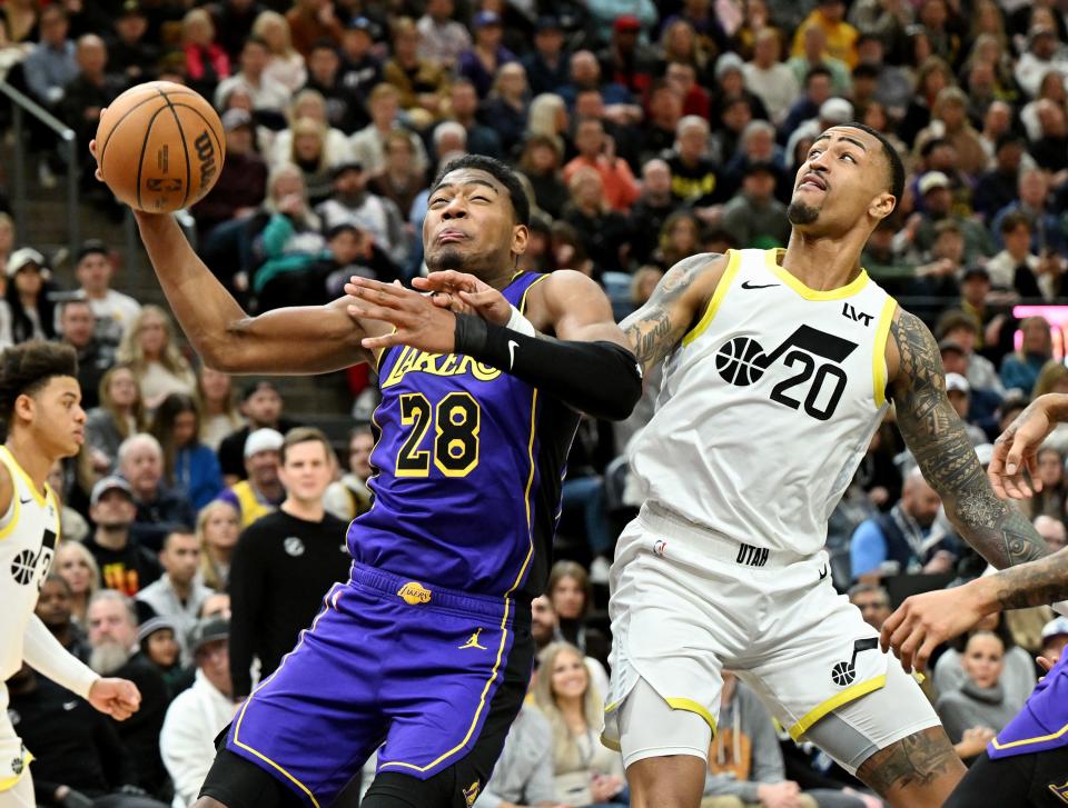 Los Angeles Lakers forward Rui Hachimura (28) works for a shot with Utah Jazz forward John Collins (20) defending as Utah and Los Angeles play at the Delta Center in Salt Lake City on Saturday, Jan. 13, 2024. Utah won 132-125. | Scott G Winterton, Deseret News