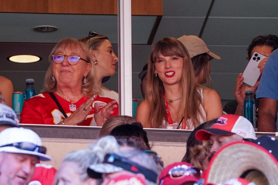 Taylor Swift reacts while sitting next to Donna Kelce watching the Kansas City Chiefs vs. Chicago Bears game at Arrowhead Stadium.