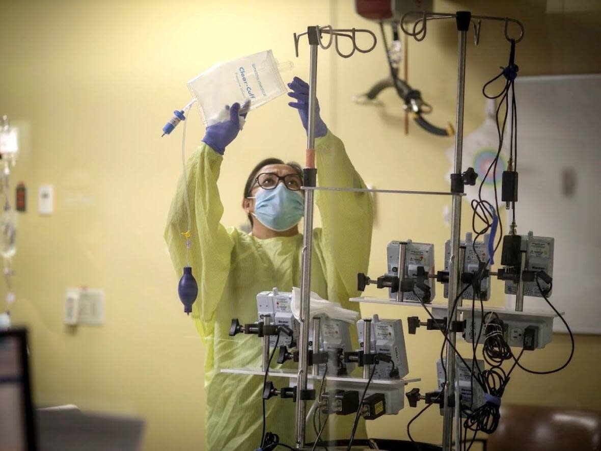 A staff member works at an intensive care unit at an Alberta hospital during the COVID-19 pandemic. ICUs in Alberta have been pushed to the brink in the province's fourth wave. (AHS - image credit)