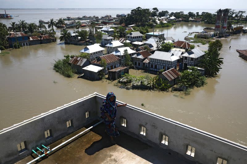 FILE PHOTO: Houses located beside the Padma river are seen flooded as the flood situation worsens in Munshiganj district, on the outskirts of Dhaka