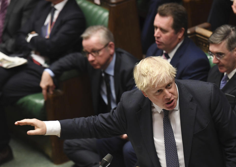 Britain's Prime Minister Boris Johnson speaks to lawmakers inside the House of Commons during the regular Prime Minister's Question time, in London Wednesday Oct. 23, 2019. According to news reports Johnson may push for an early General Election. (Jessica Taylor / House of Commons via AP)