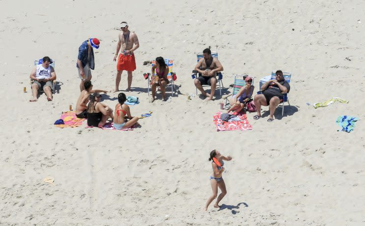 In this Sunday, July 2, 2017, photo, New Jersey Gov. Chris Christie, right, uses the beach with his family and friends at the governor's summer house at Island Beach State Park in New Jersey. (Photo: Andrew Mills/NJ Advance Media via AP)