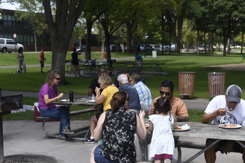 Attendees enjoy lunch on Aug. 11 at Lake George for the 2nd annual Unity Picnic hosted by the Baha'is of Central Minnesota.