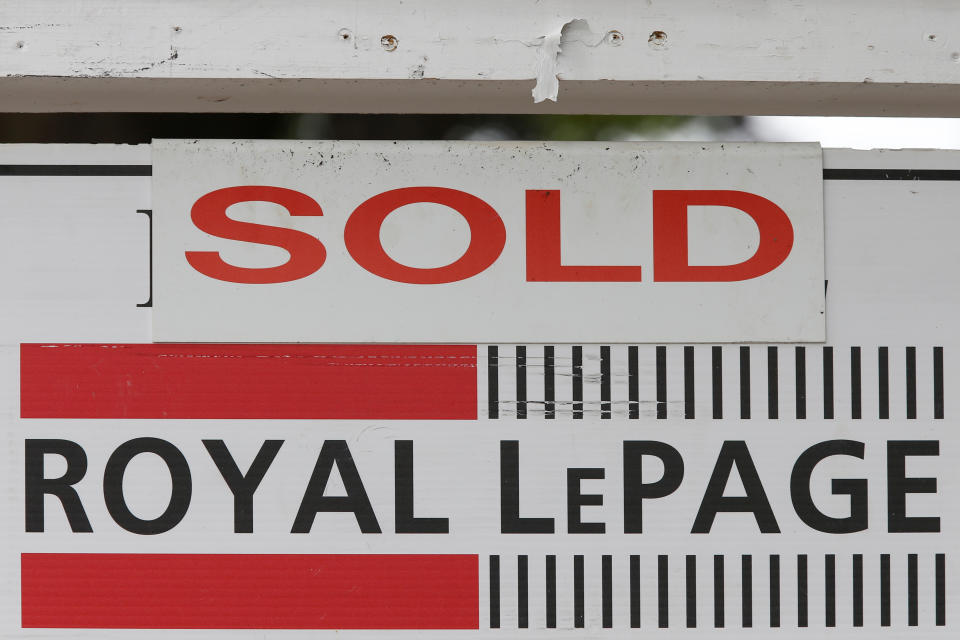 A Royal LePage real estate sign is marked "Sold" in front of a house in Ottawa, Ontario, Canada, August 15, 2017. REUTERS/Chris Wattie