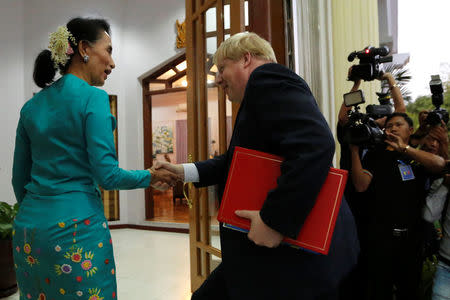 British Foreign Secretary Boris Johnson (R) is welcomed by Myanmar's leader Aung San Suu Kyi in Naypyidaw, Myanmar January 20, 2017. REUTERS/Soe Zeya Tun