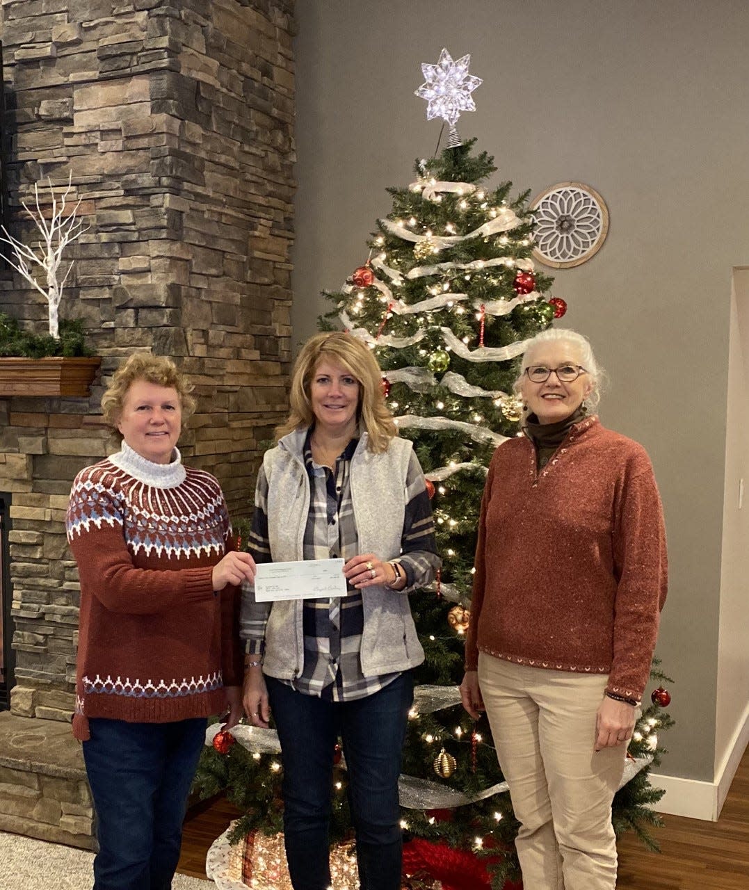 Pictured (from left) are Barb Carlisle, Central United Methodist Church Endowment Fund Board member and hospice volunteer, Hospice of the EUP Director Tracey Holt, and Central United Methodist Church pastor Vickie Hadaway.